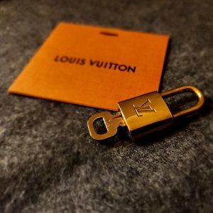 #314 Authentic Louis Vuitton lock and key set include LV envelope with card